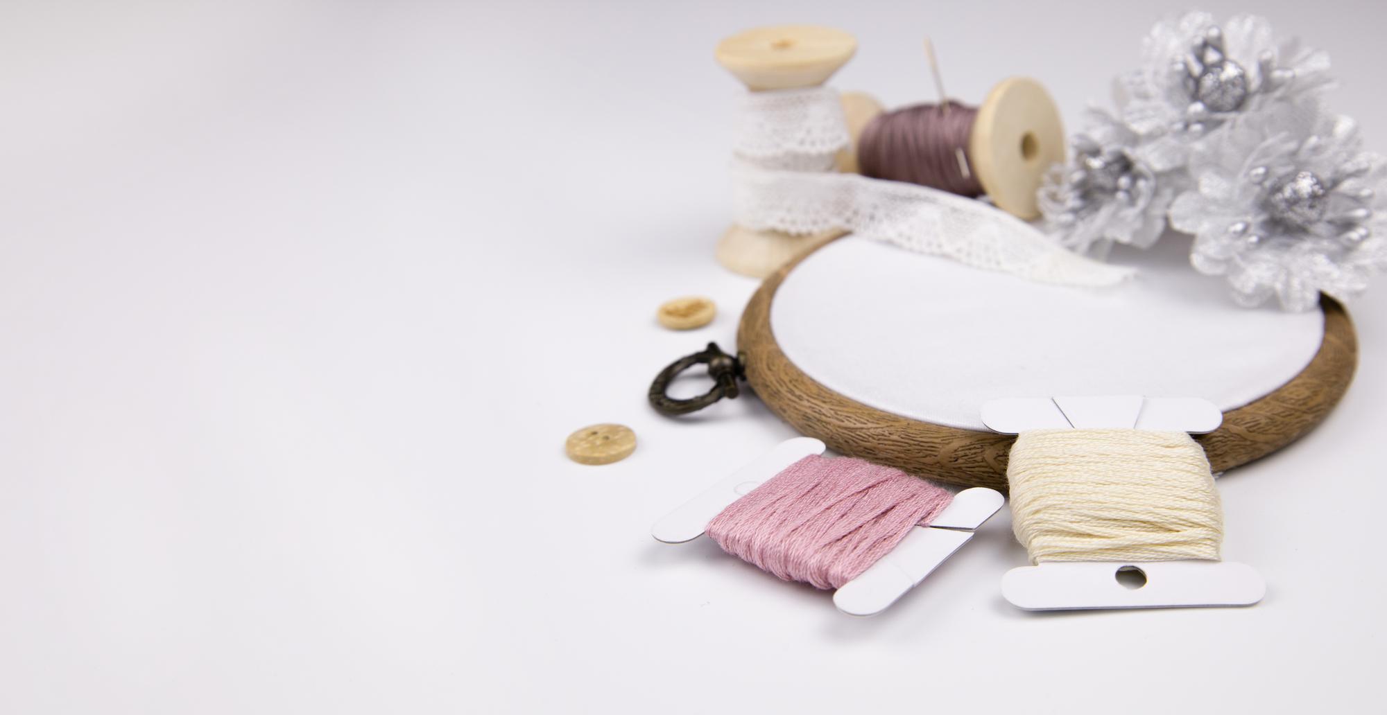 Atelier workspace with threads and hoop